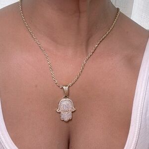 Stainless steel gold necklace with evil eye pendant.